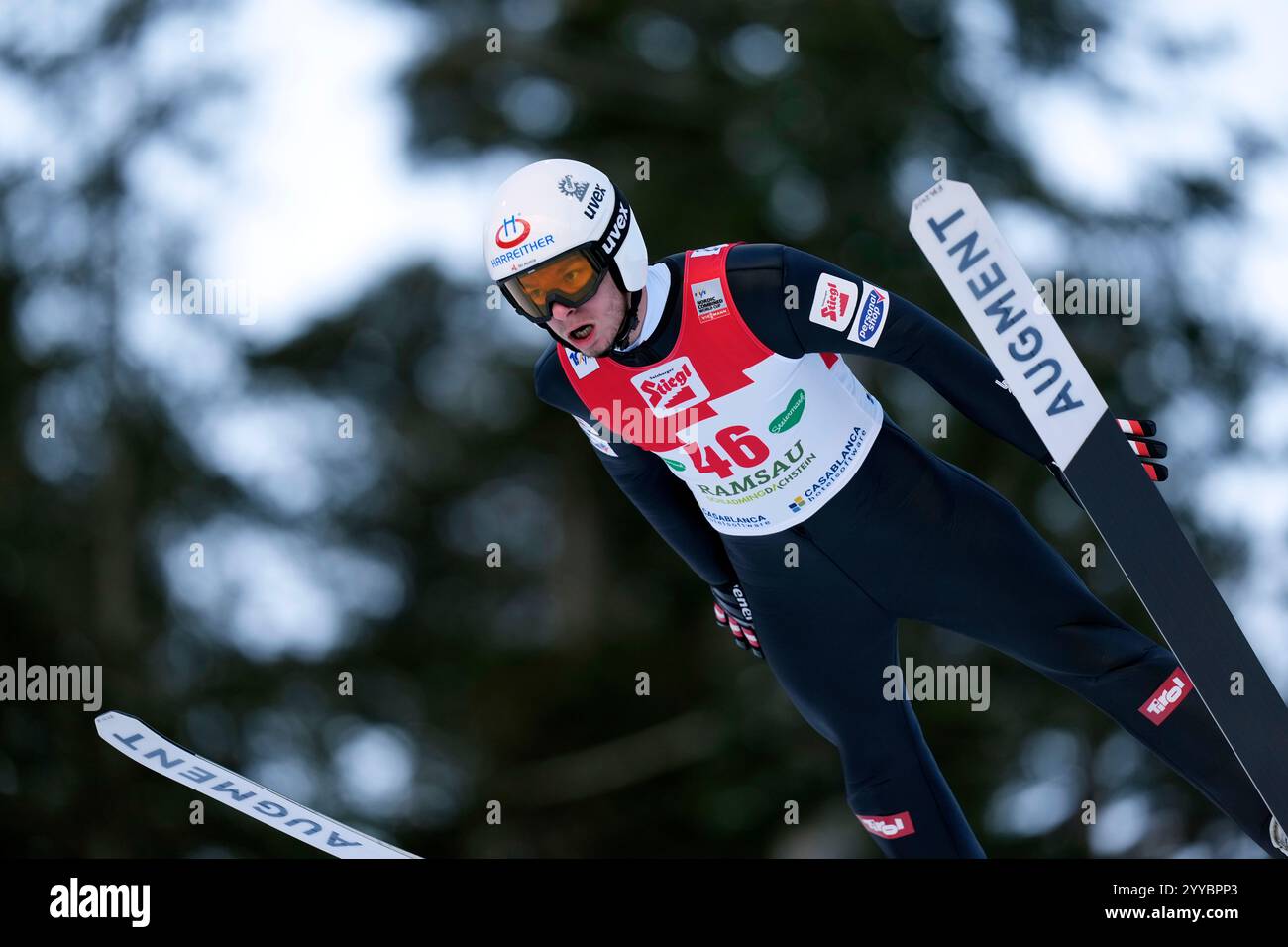 Martin Fritz, of Austria, soars through the air during the men's ...