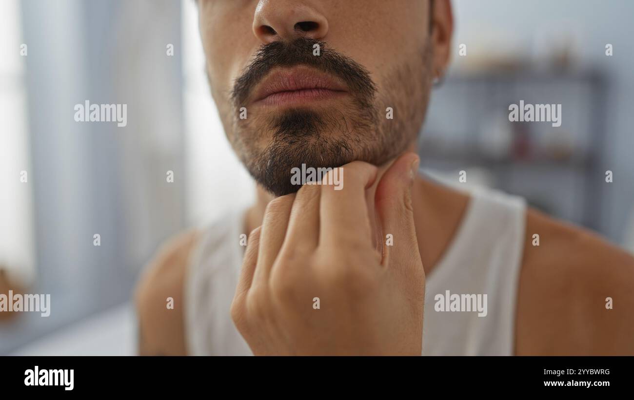 Hispanic man touching chin hi-res stock photography and images - Alamy