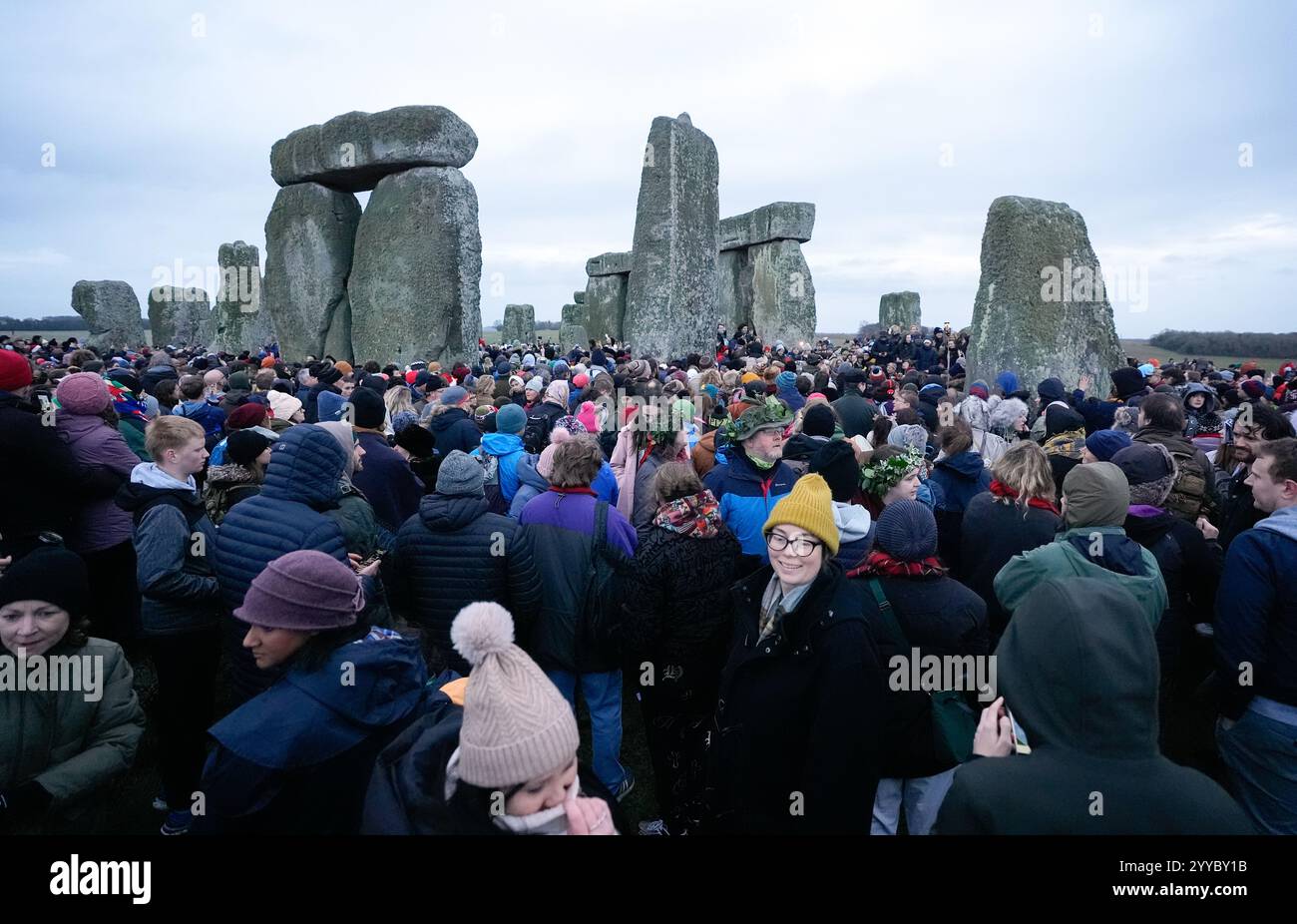 People take part in the winter solstice celebrations during sunrise at