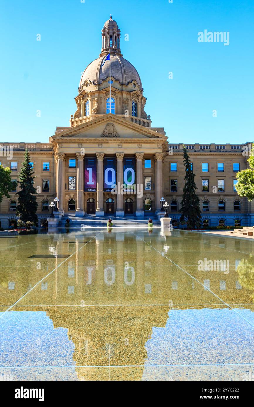 A large building with a 100 banner on it. The building is surrounded by ...