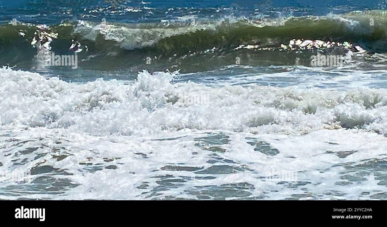 Foamy ocean waves roll onto hi-res stock photography and images - Alamy