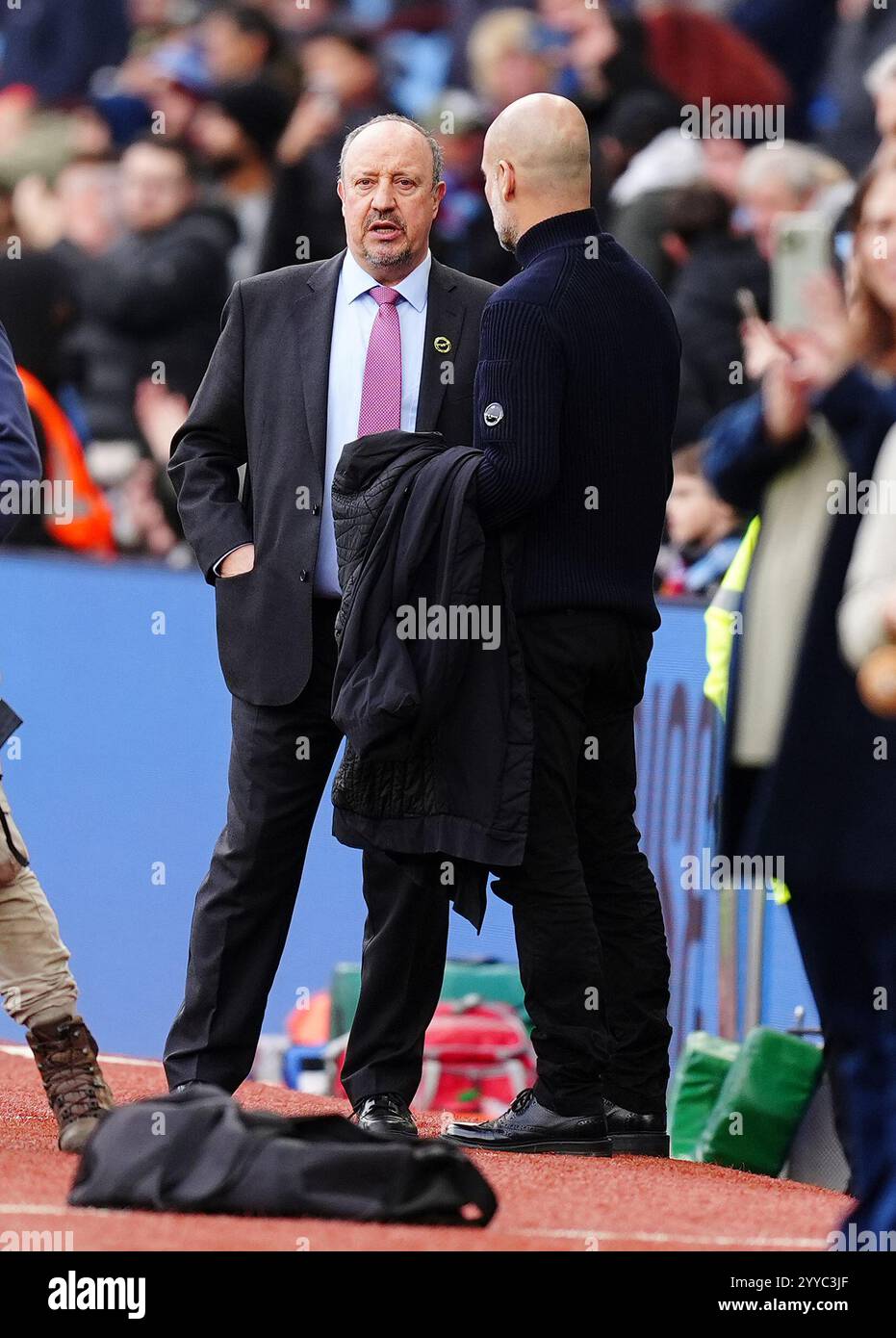 Manchester City manager Pep Guardiola (right) with Rafael Benitez ahead ...