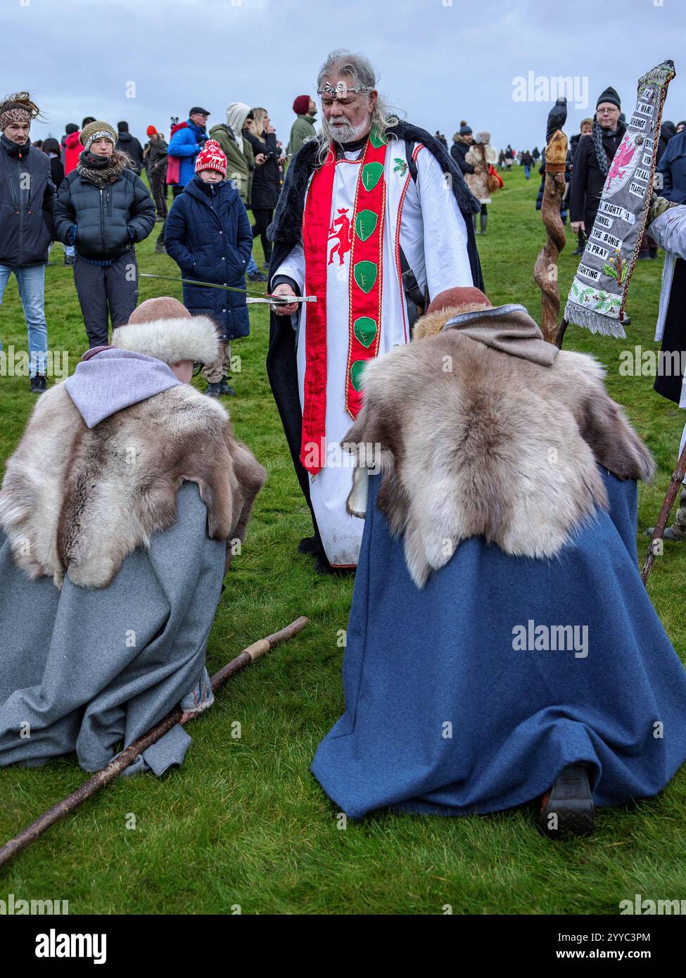 Salisbury, UK. 21st Dec, 2024. Druids celebrate at sunrise on the