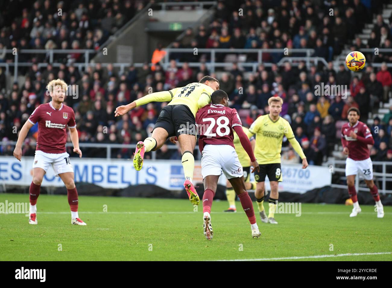 Northampton, England. 21st Dec 2025. Miles Leaburn heads towards goal