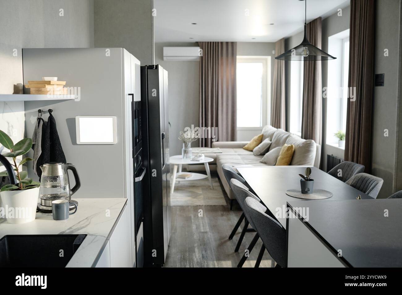 Image showcasing Roomy studio apartment illumed with sunrays through huge rectangular ...