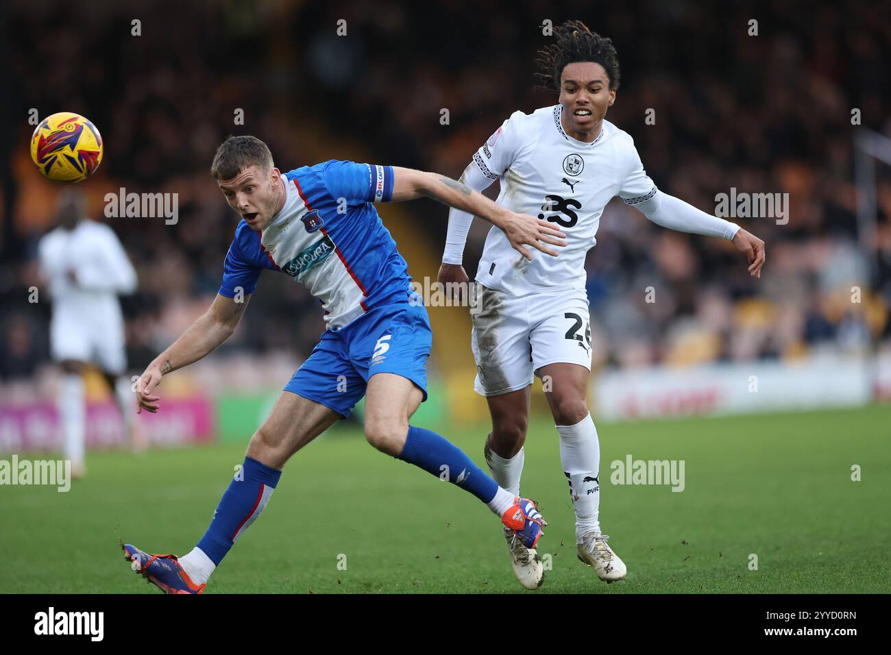 Port Vale???s Rico Richards and Carlisle United???s Sam Lavelle during the Sky Bet Championship match at Vale Park, Stoke-on-Trent. Picture date: Saturday December 21, 2024. Stock Photo