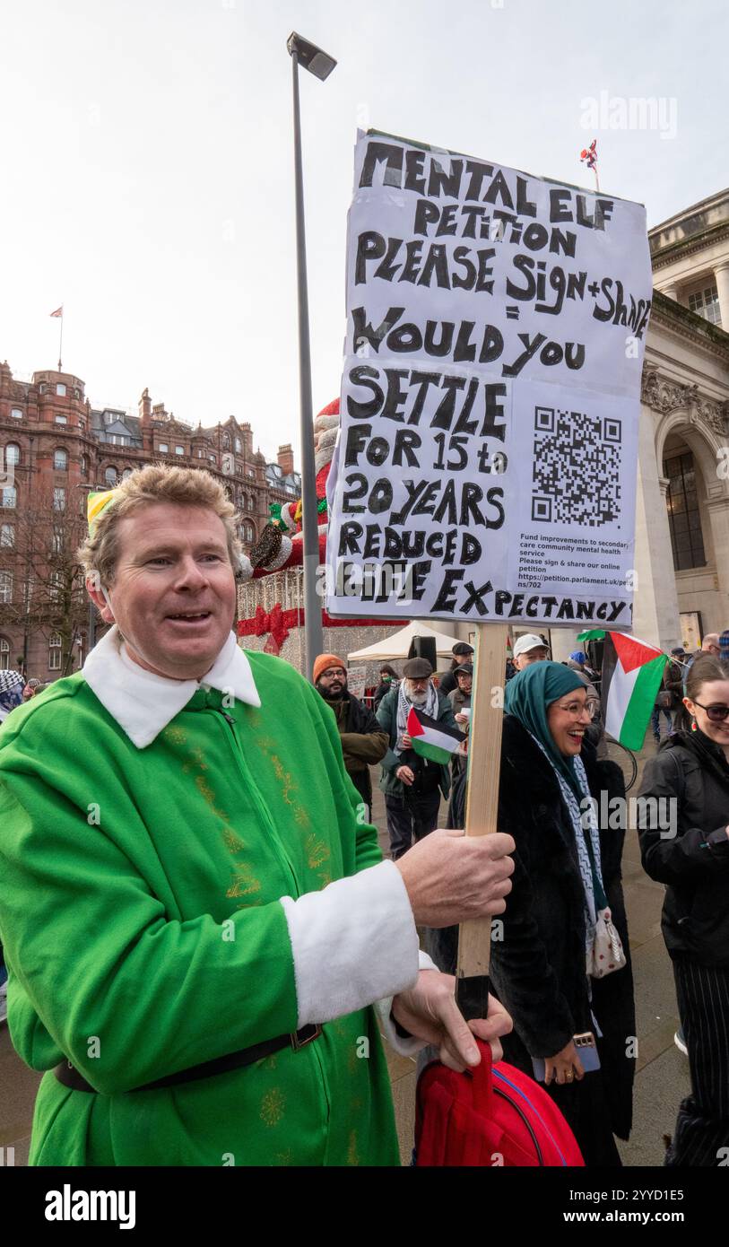 Will Ferrell Elf look alike. Mental health campaigner . Palestinian protest in Manchester UK. The last planned weekly protest before Christmas. The protest went through the city centre passing through the Christmas markets. Many placards refered to the Christmas season. Manchester UK. Picture: garyroberts/worldwidefeatures.com Stock Photo