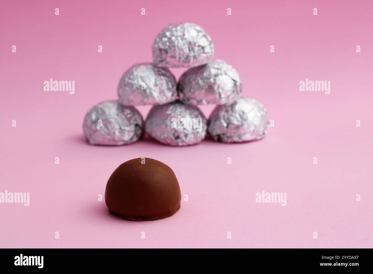 Round chocolate covered marshmallow versus others with silver wrapper ...