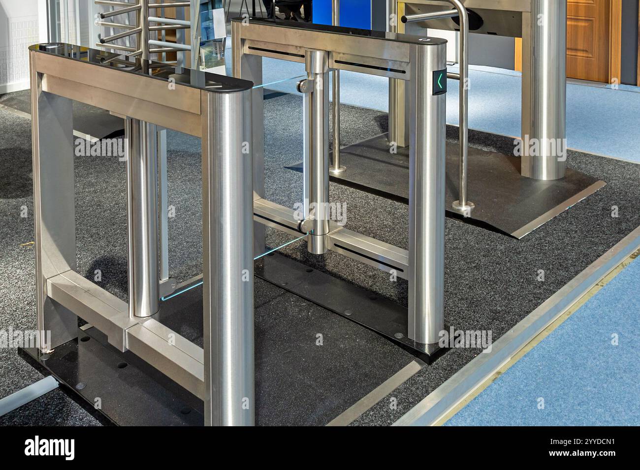 Entrance gate with glass door and metal frames inside modern interior ...