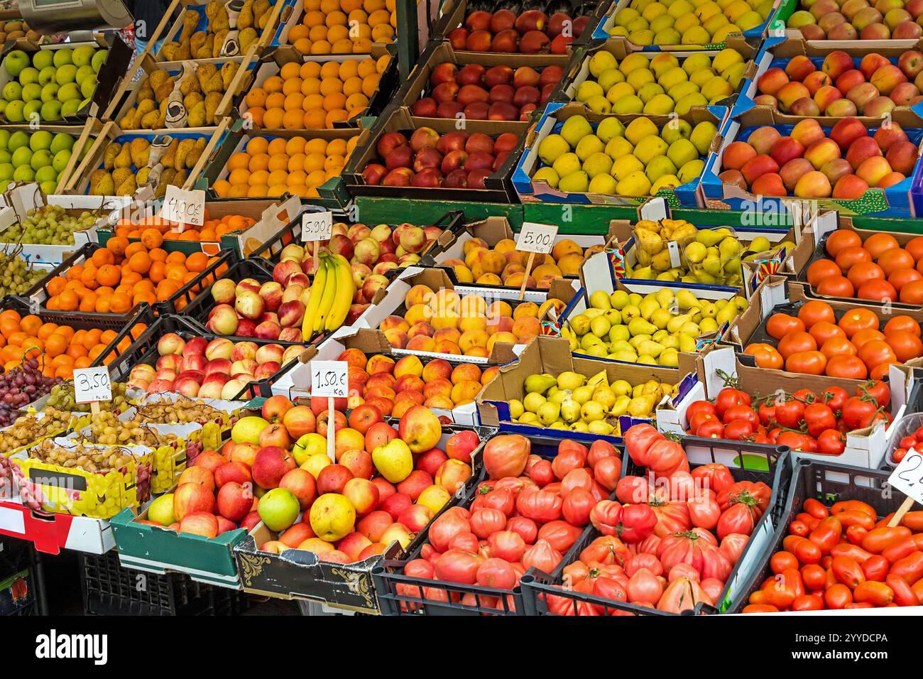 Pile of fresh organic fruits and vegetables outside on a market stall ...