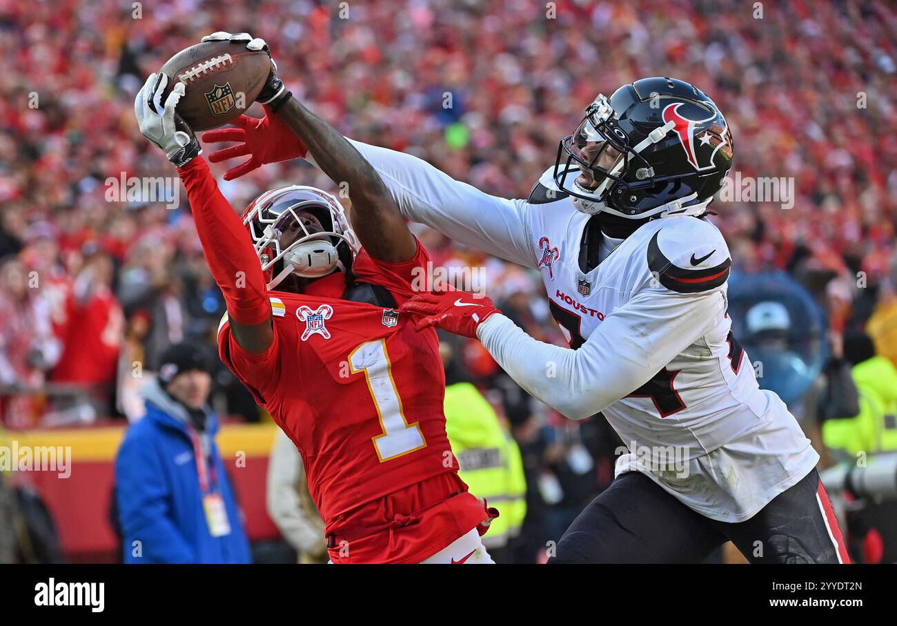 Kansas City Chiefs wide receiver Xavier Worthy (1) reaches up for the