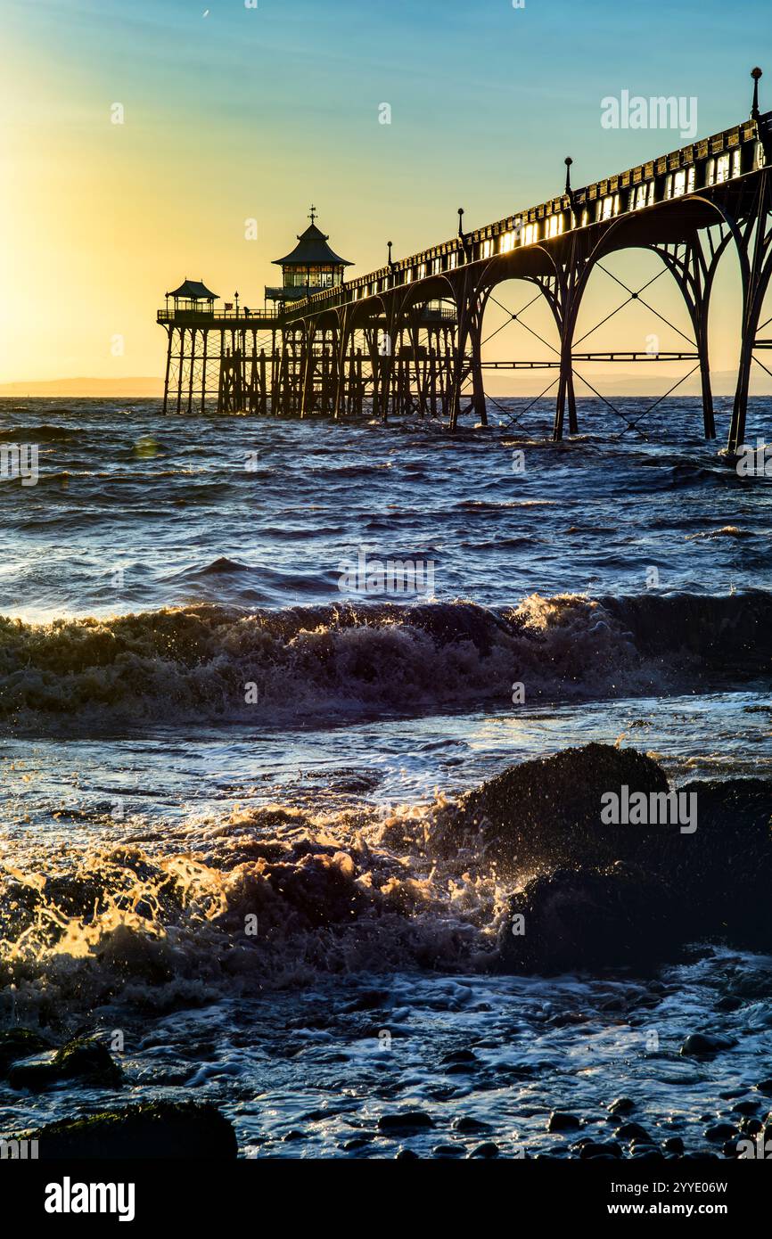 Clevedon Pier In The Golden Hour At Sunset With Sunlit Shoreline And clevedon-pier-in-the-golden-hour-at-sunset-with-sunlit-shoreline-and
