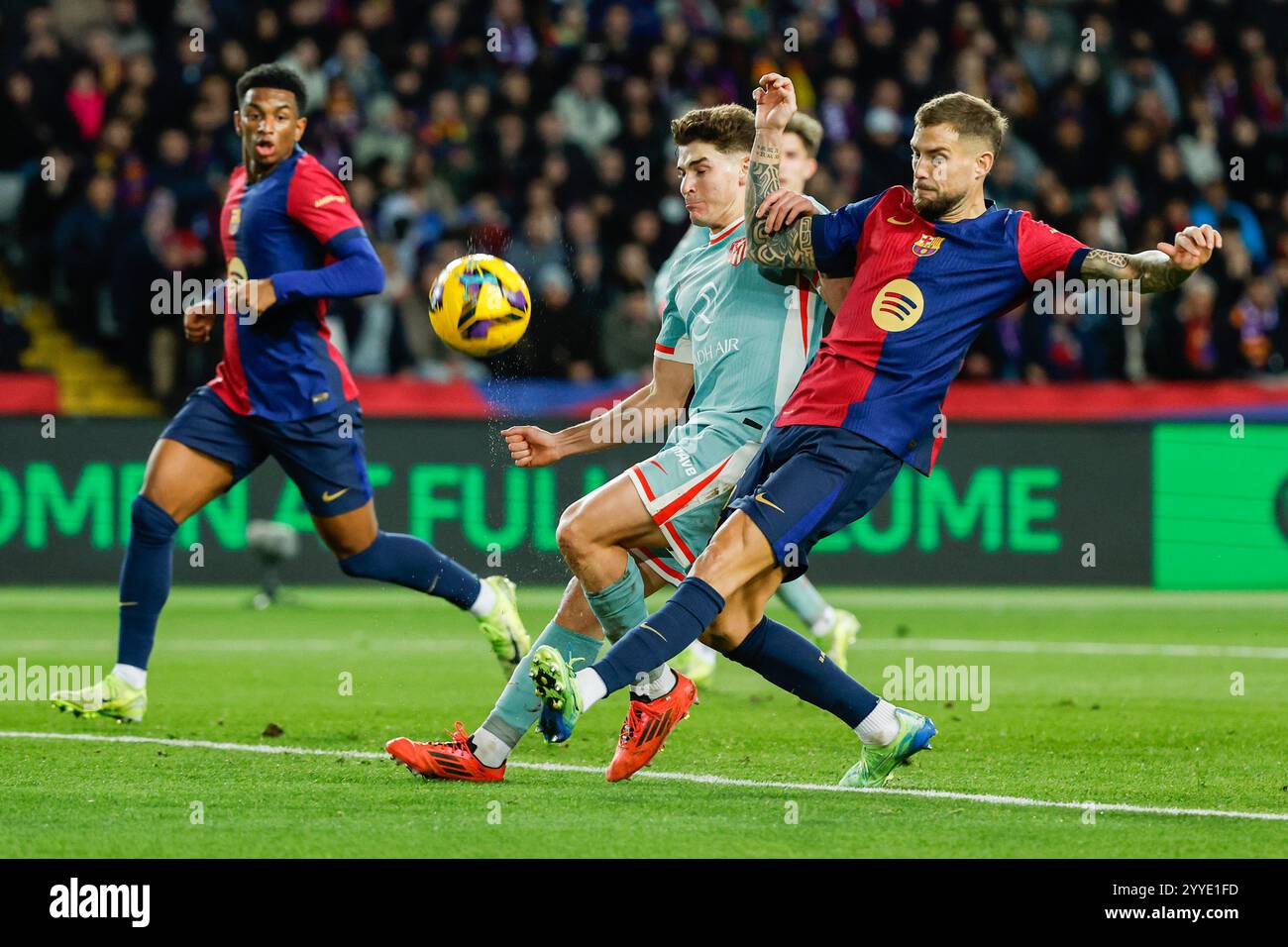 Julian Inigo Barcelona's Inigo Martinez, right, duels for the ball with Atletico ...