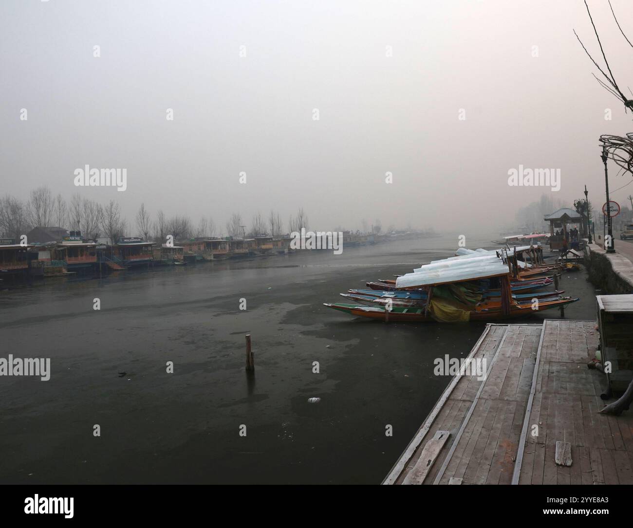 Srinagar, India. 21st Dec, 2024. SRINAGAR, INDIA - DECEMBER 21: A view of a frozen surface parts of Dal Lake on December 21, 2024 in Srinagar, India. Kashmir is in the grip of a cold wave and the 40-day period of Chillai Kalan (major cold) began in the Valley on an icy note with Srinagar witnessing temperatures of minus 8.5 degrees Celsius, the coldest in 34 years for the same period. All other parts of Kashmir also witnessed sub-zero temperatures.(Photo by Waseem Andrabi/Hindustan Times/Sipa USA) Credit: Sipa USA/Alamy Live News Stock Photo