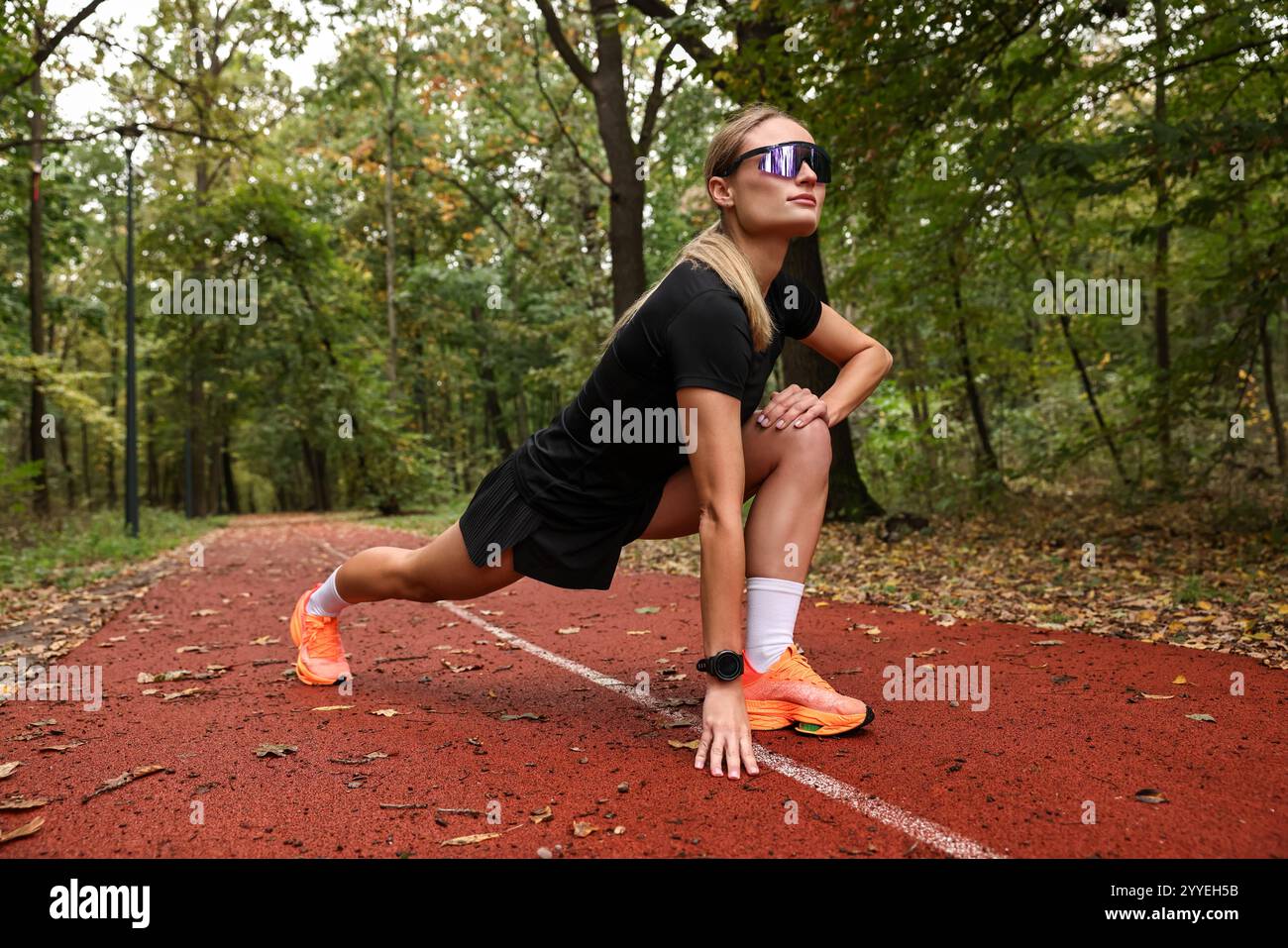 Young athletic woman stretching hi-res stock photography and images - Alamy