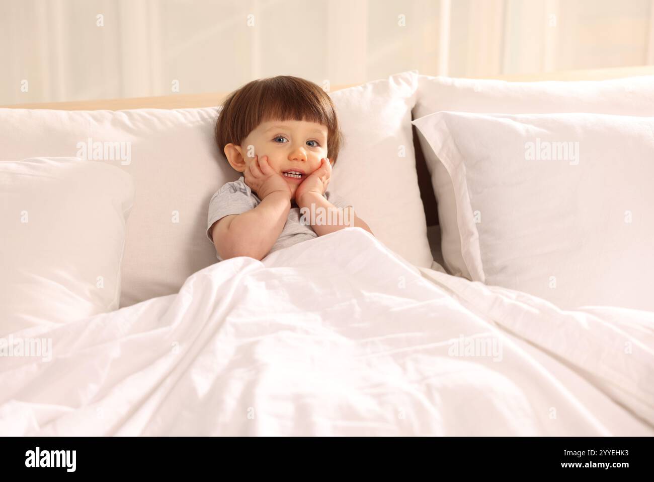 Cute little boy in bed at home Stock Photo - Alamy