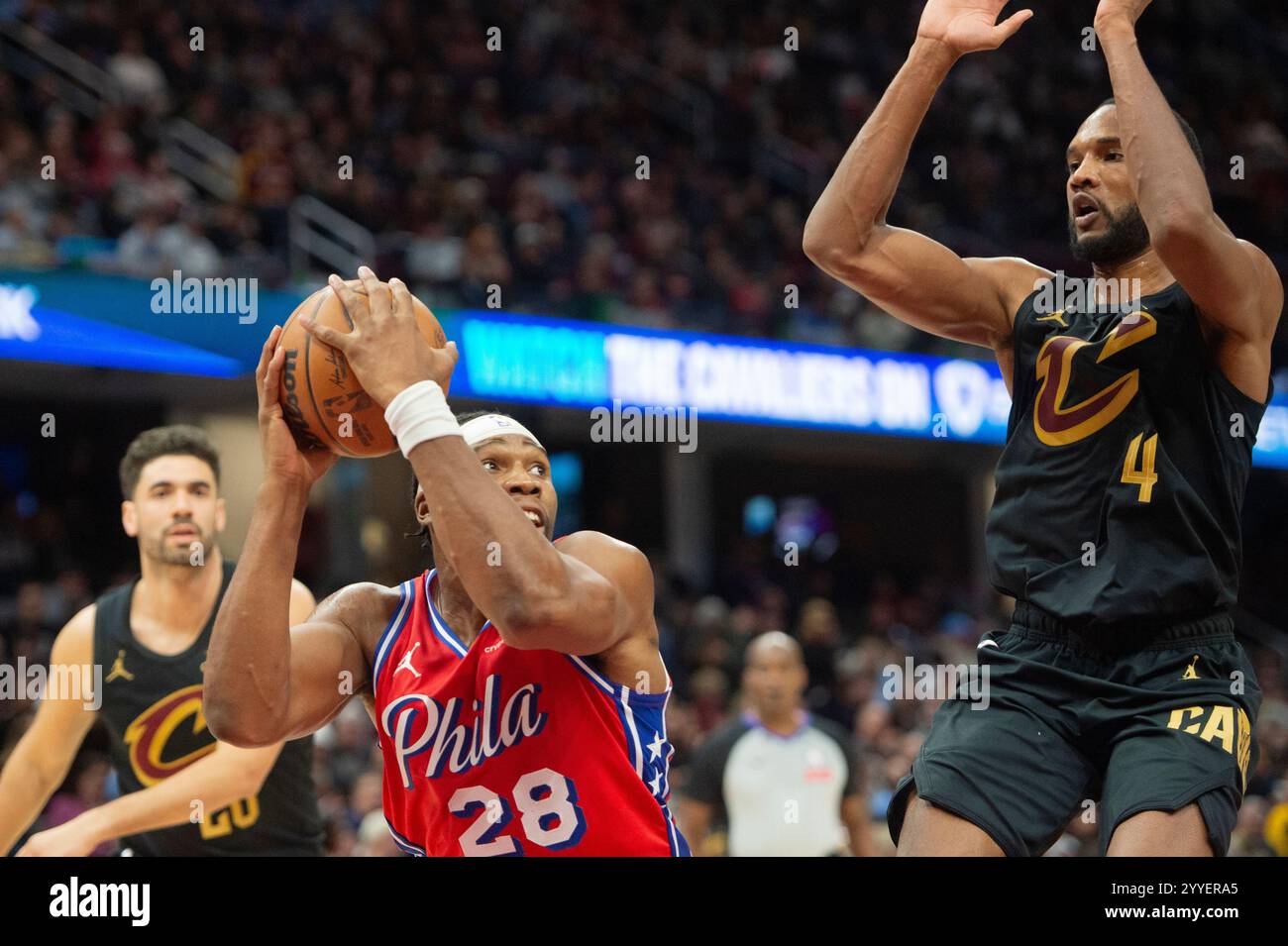 Philadelphia 76ers' Guerschon Yabusele (28) grabs a rebound as