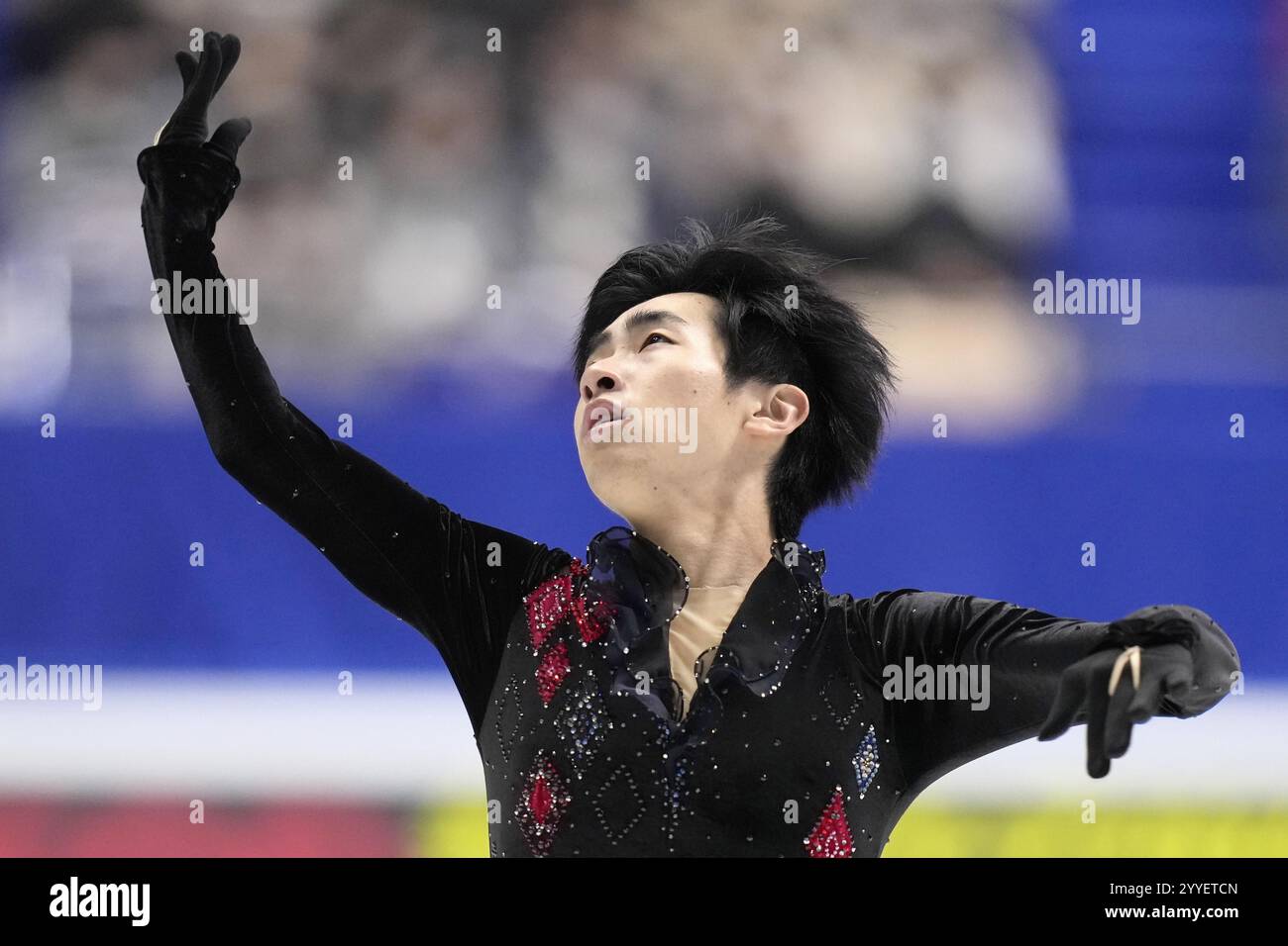 Tatsuya Tsuboi performs in the men's free program at the national