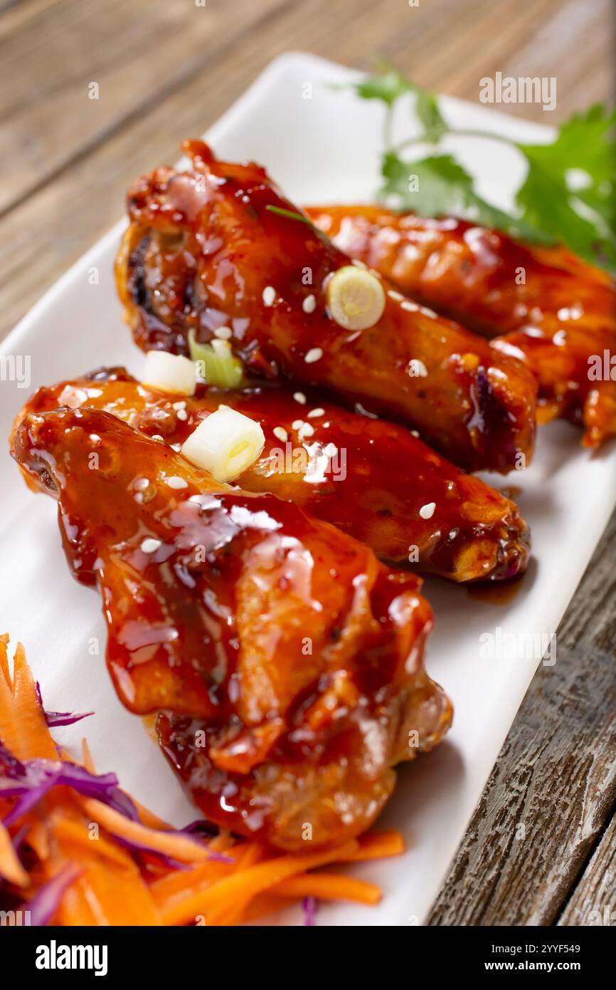 A view of an appetizer plate of Asian BBQ wings. Stock Photo