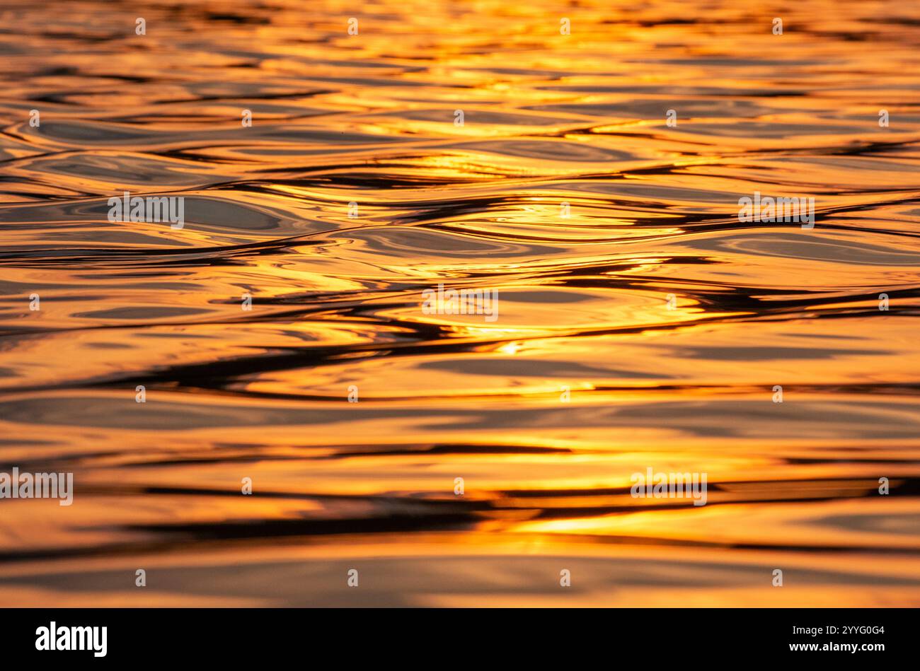 Sunset reflections on water lake Stock Photo