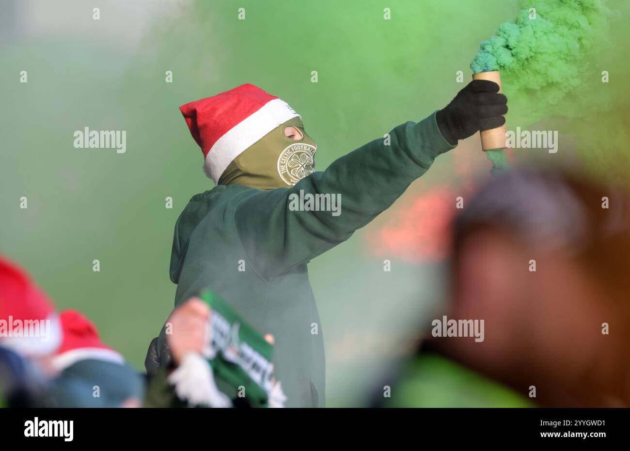 Celtic fan holding a smoke bomb during the William Hill Premiership ...