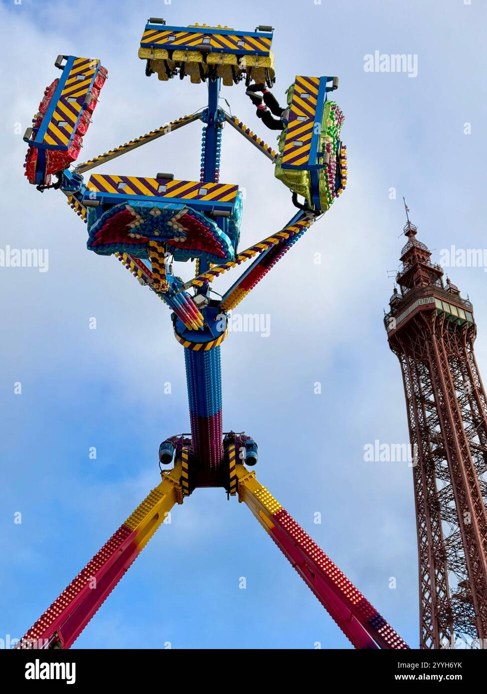 Blackpool Tower with thrill ride in foreground (part of Winter Market on Blackpool promenade) - Smartphone Captured Stock Image