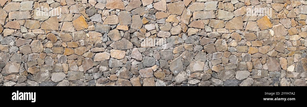 Stone masonry wall texture panoramic backgound Stock Photo