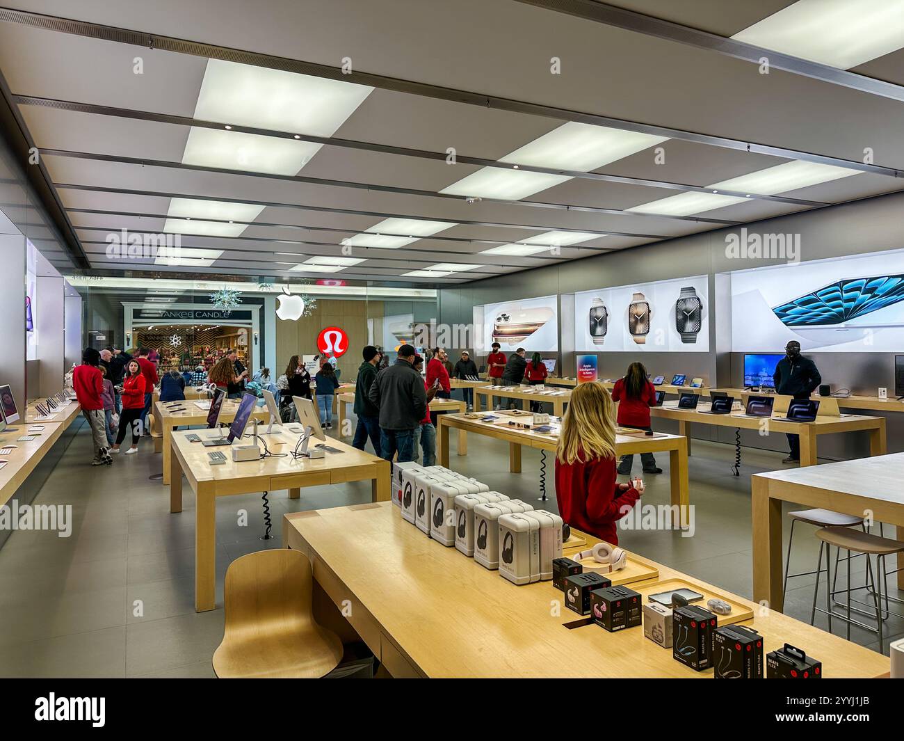 Customers shopping in an Apple store - Smartphone Captured Stock Image