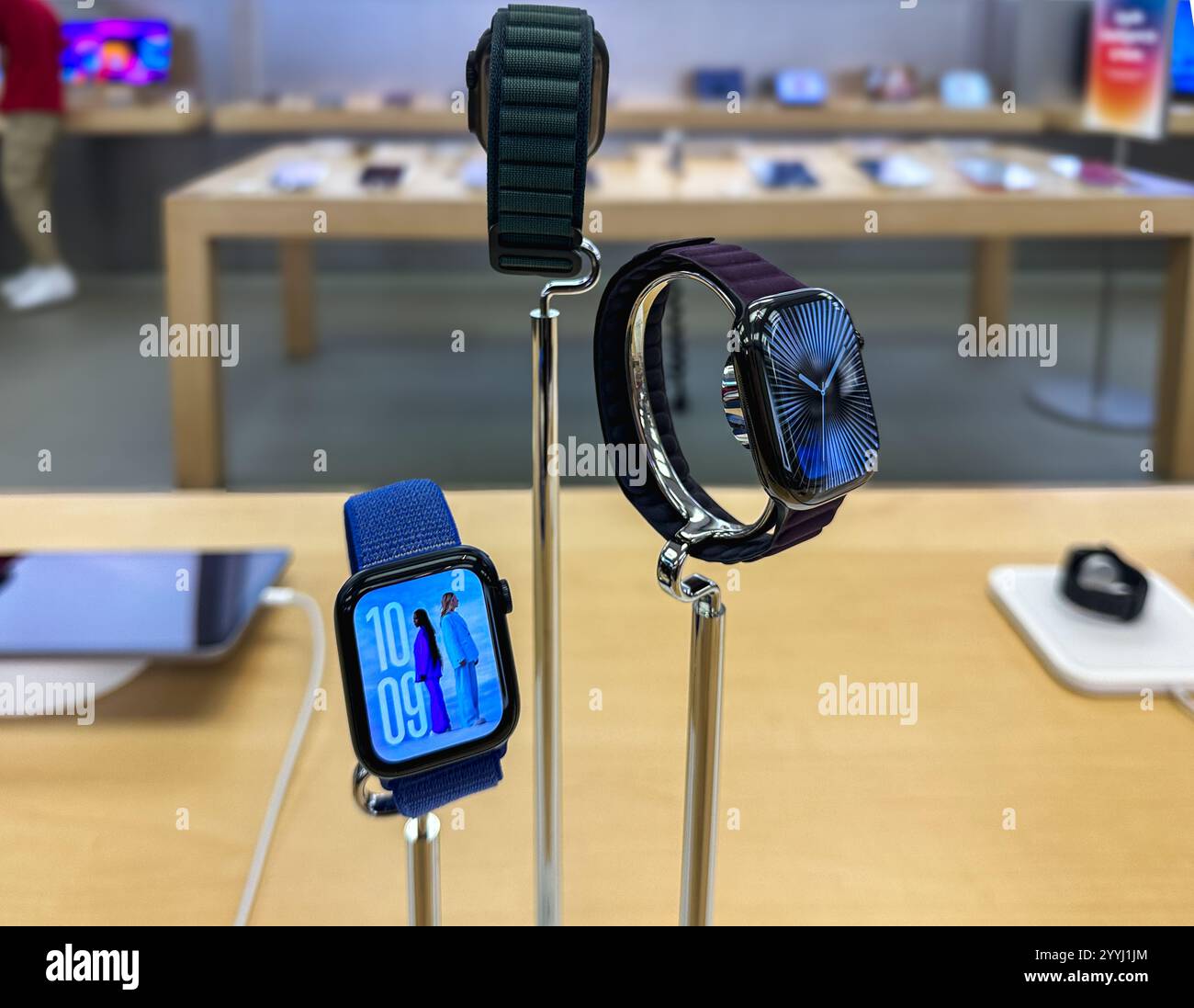 Apple Watches on display in an Apple Store - Smartphone Captured Stock Image