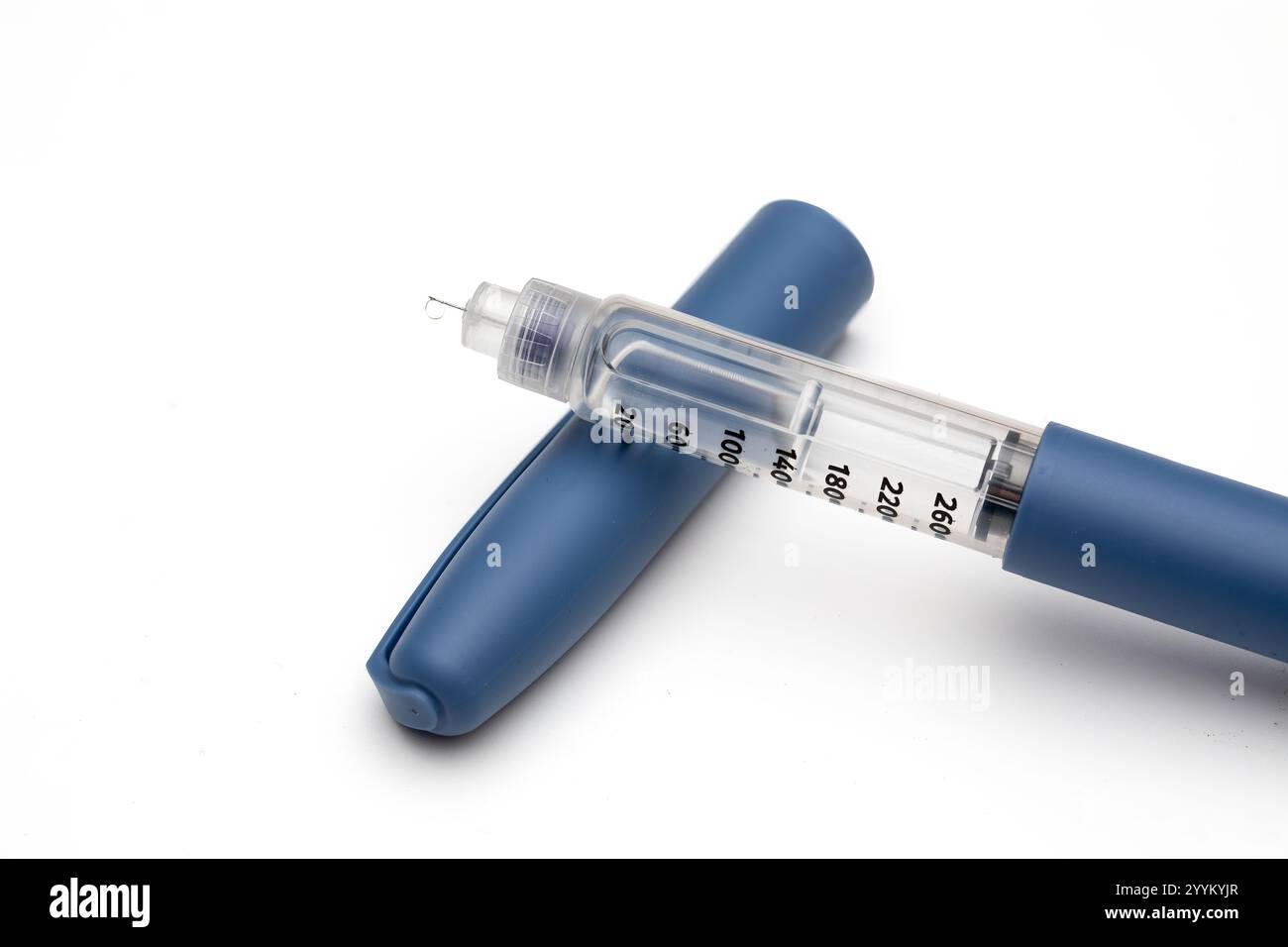 Close-Up of Insulin Pen with Needle and Insulin Droplet Before Injection Stock Photo
