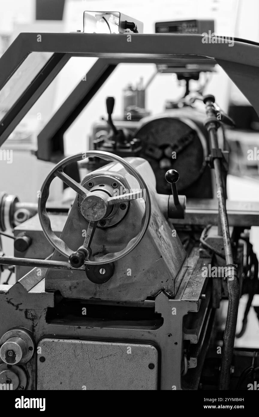 Old conventionnal lathe in a mechanical workshop Stock Photo