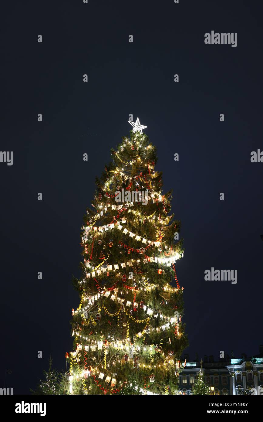 A Beautifully Illuminated Christmas Tree at Night, Glowing Brightly ...