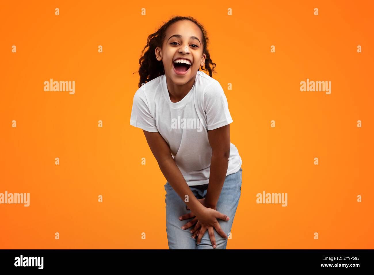 Cute Joyful African American Girl Laughing At Camera Stock Photo - Alamy