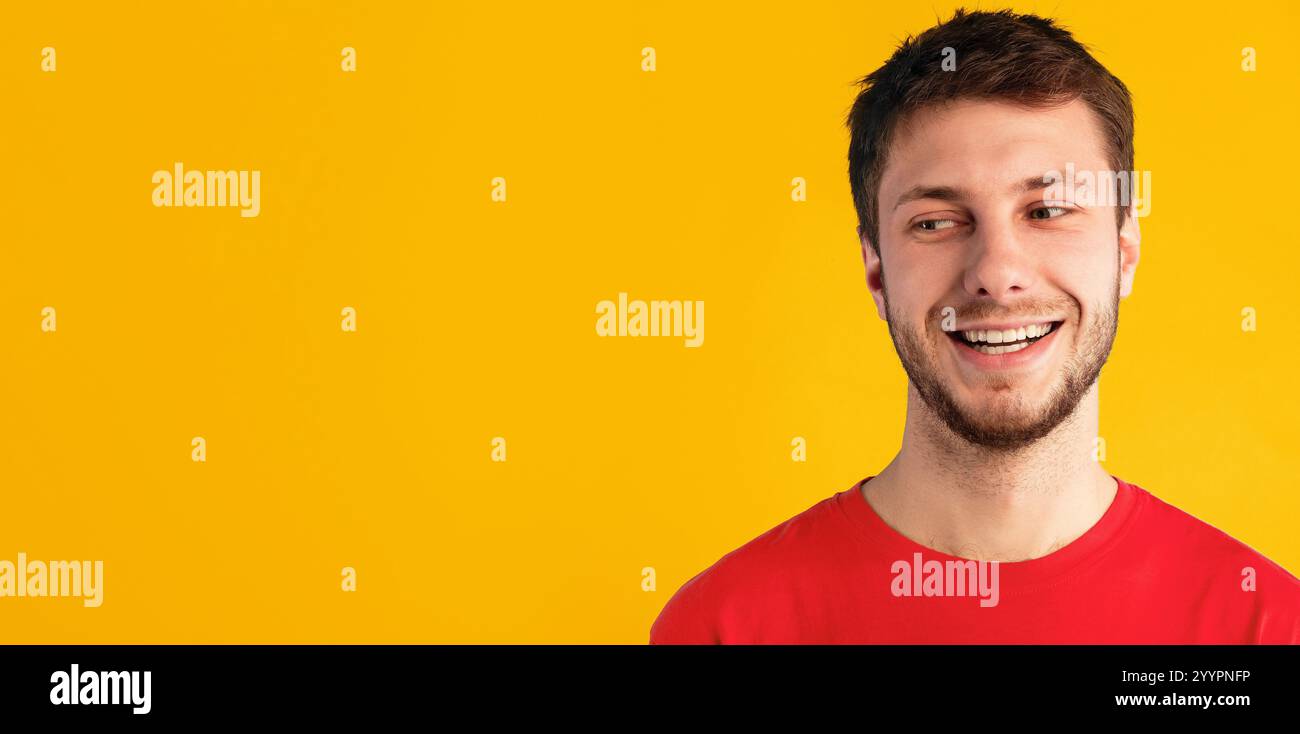 Smiling confident man looking at copy space on blue background Stock Photo