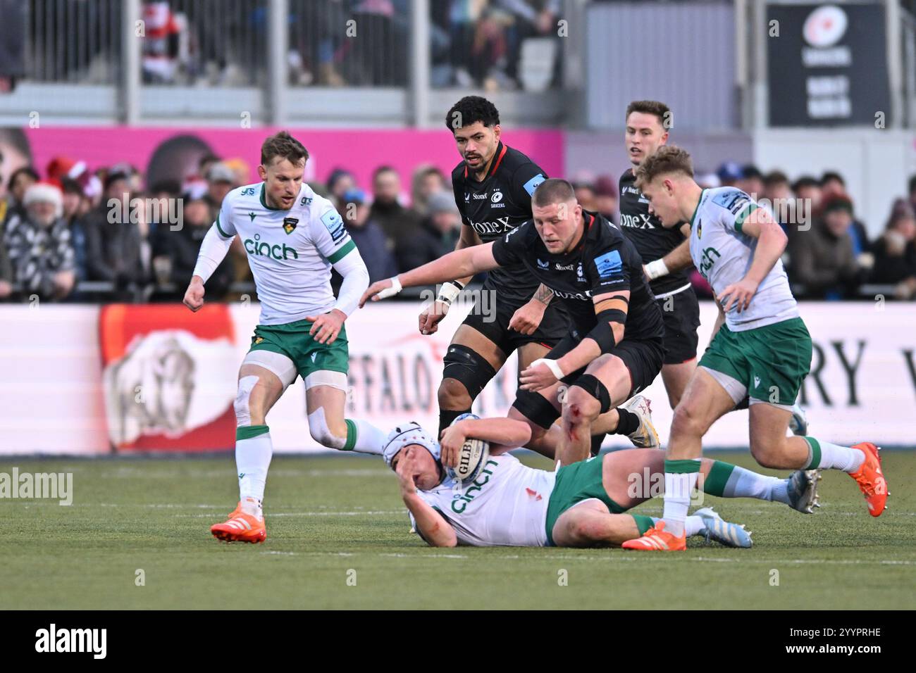 Curtis Langdon of Northampton Saints is tackled during the Gallagher ...