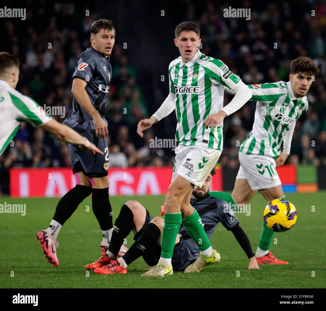 Vibrant La Liga Round Up: Real Betis Cruise Past Osasuna As Rayo Slip Against Sevilla Background Digital Art Vibrant La Liga Round Up: Real Betis Cruise Past Osasuna As Rayo Slip Against Sevilla Background Digital Art