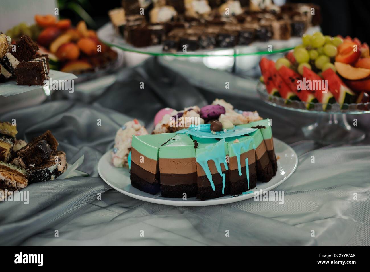 Colorful Dessert Display featuring Layered Cake and Assorted Sweets ...