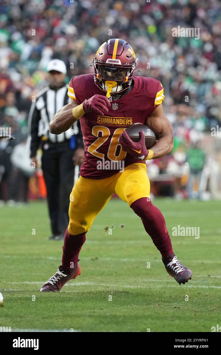 Washington Commanders running back Jeremy McNichols (26) rushes for a