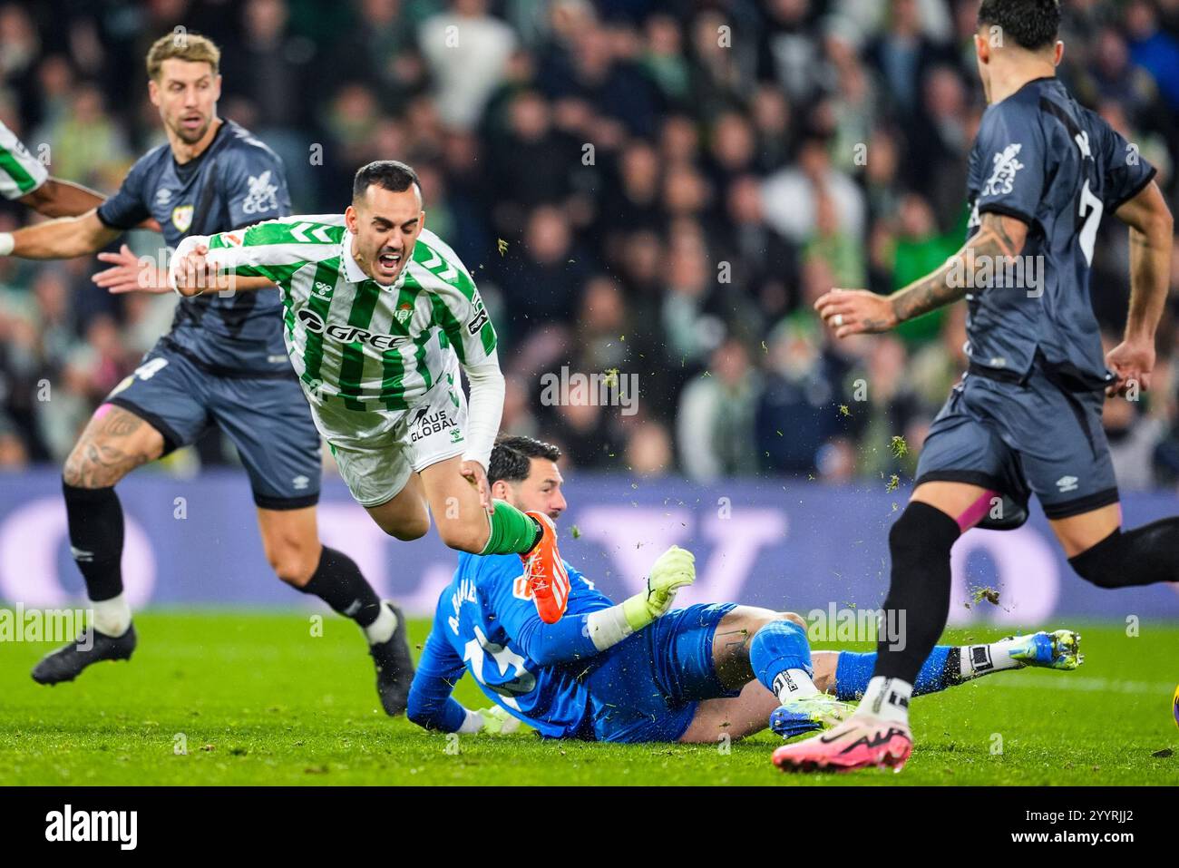 Juanmi Jimenez of Real Betis and Augusto Batalla of Rayo Vallecano in ...