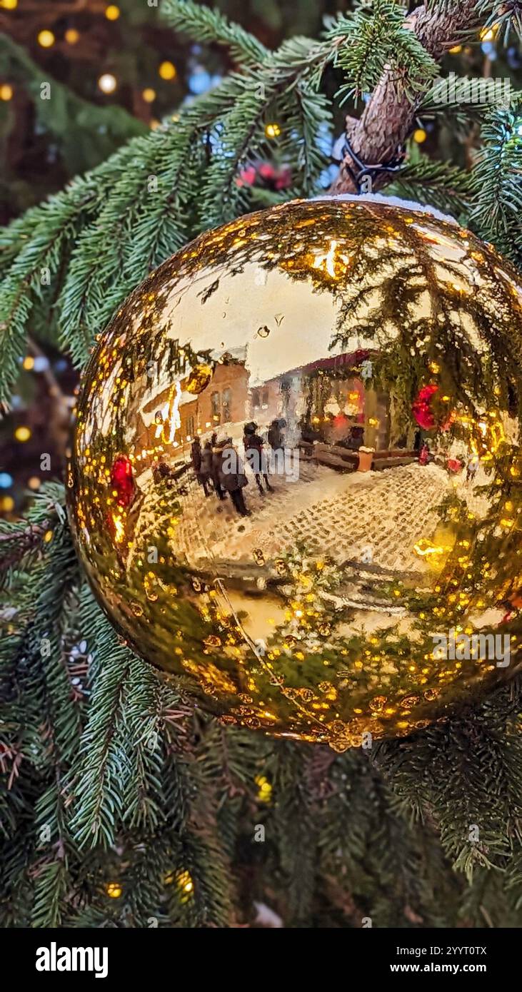 Reflective Golden Christmas Ornament on Tree Branch Stock Photo - Alamy