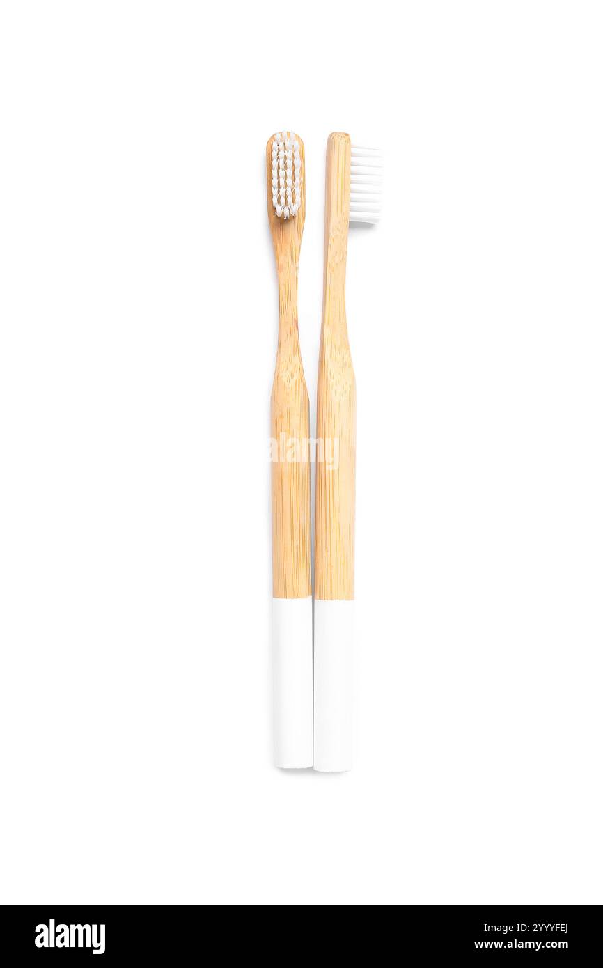 Wooden toothbrushes on white background Stock Photo - Alamy