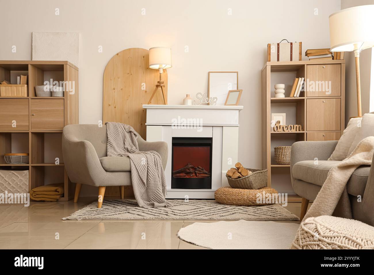 Interior of cozy living room with armchair, fireplace and shelving ...