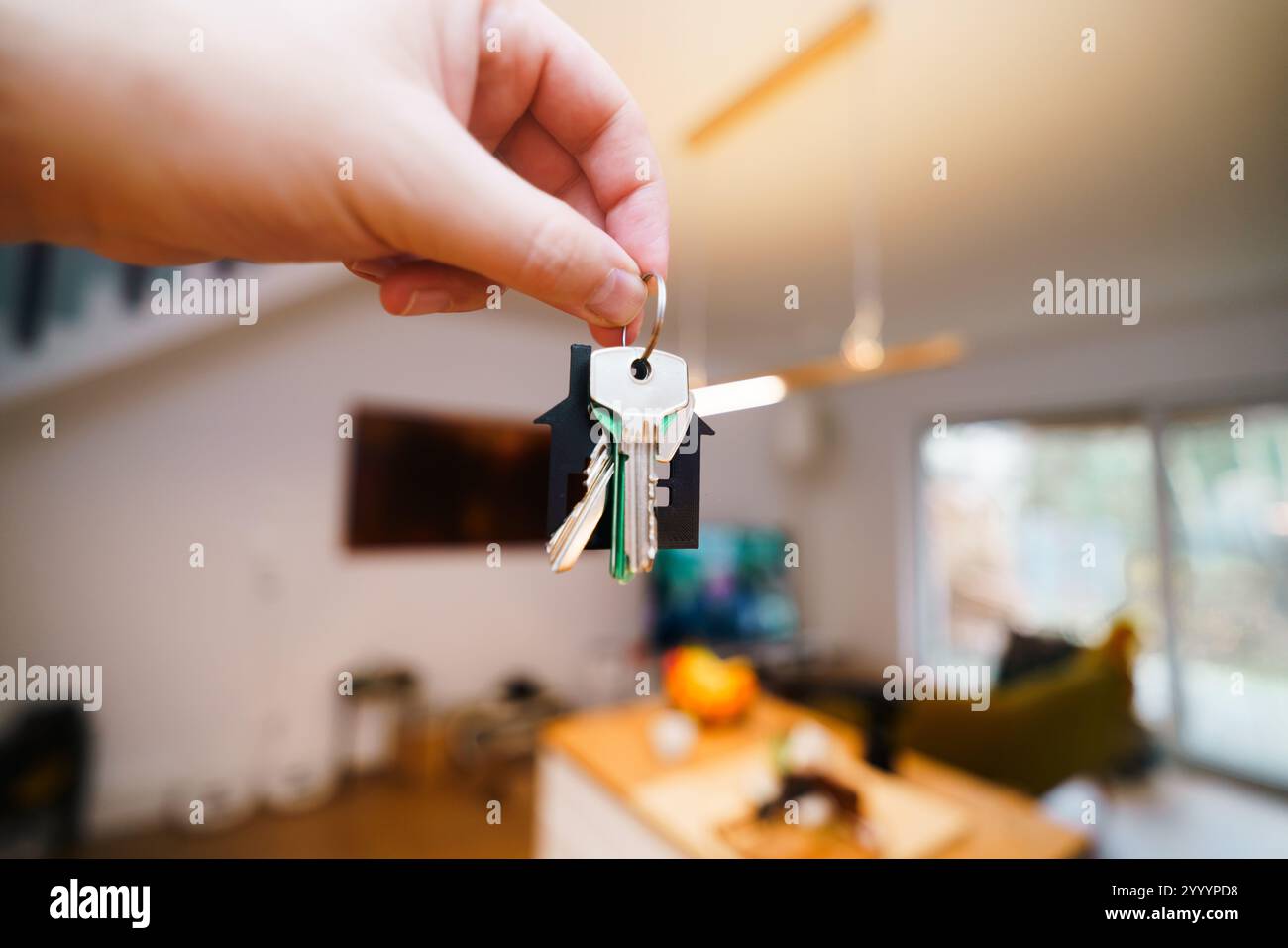 hand holding door keys new home interior real estate agent booking ...