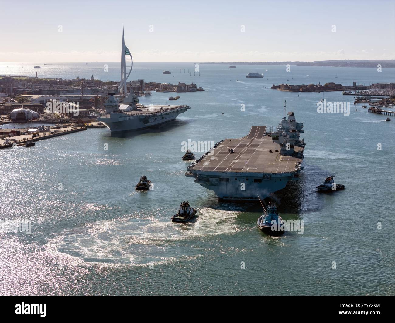 An aerial view of the Royal Navy aircraft carriers HMS Prince of Wales (R09) and HMS Queen Elizabeth (R08) in Portsmouth Harbour. Stock Photo