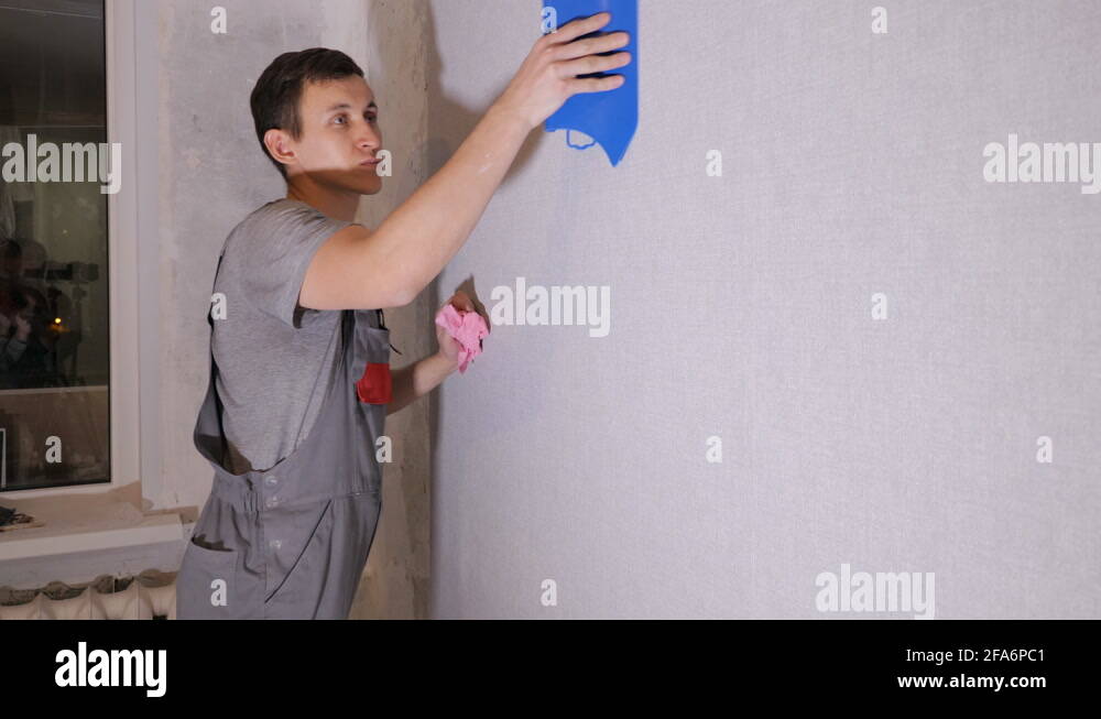 Applying wallpaper to wall Stock Videos & Footage HD and 4K Video