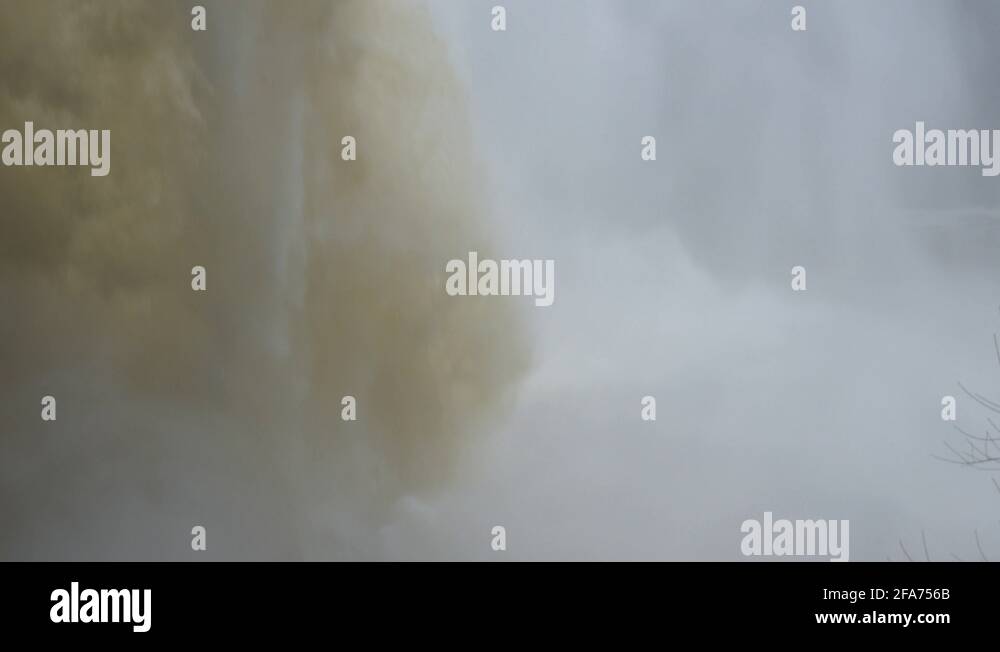 Three views of a waterfall in a normal speed. The waterfall is large ...