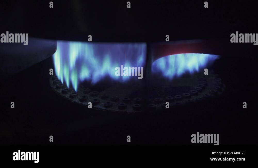 A bunsen burner creating a blue flame Stock Video Footage Alamy