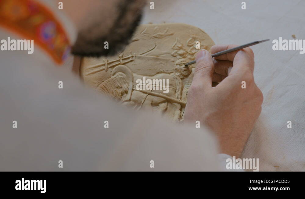 Potter making clay stamp picture Stock Video Footage Alamy