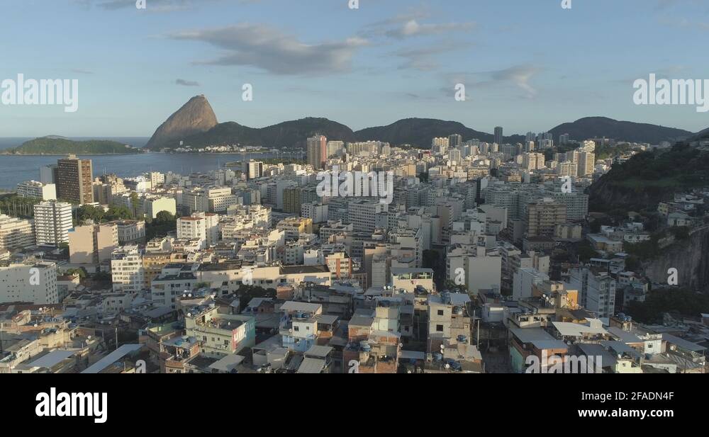 Sunny daytime aerial retreating over the Santo Amaro favela in Rio de ...