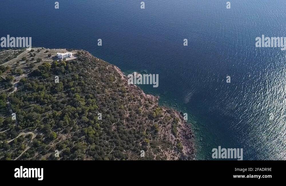 Vertical panning drone shot over the island of Aigina in Greece